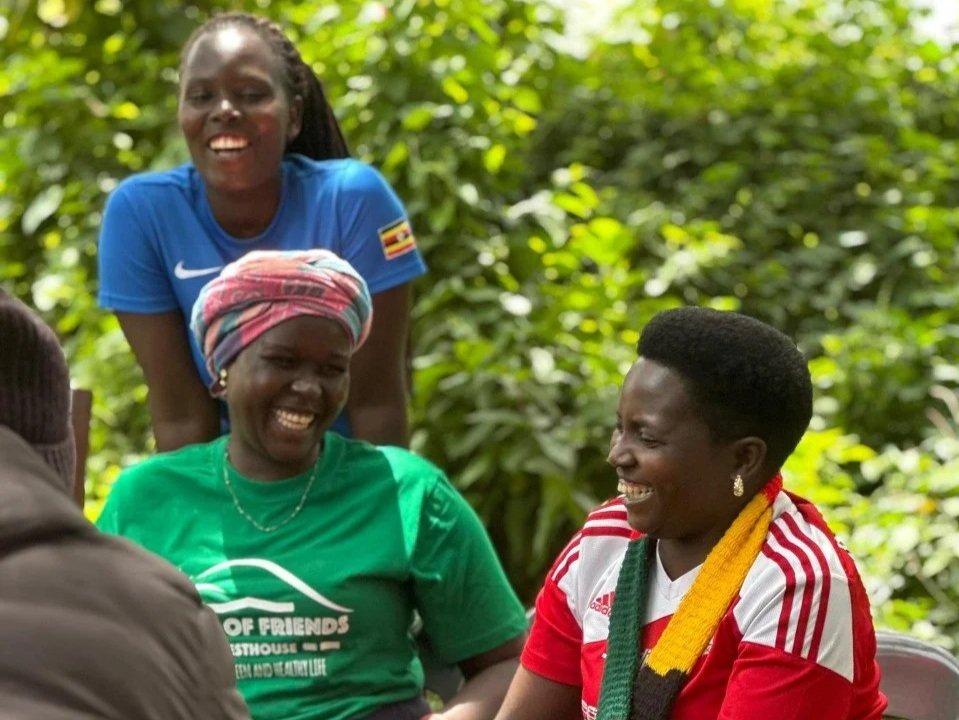 Happy Home of Friends team members during a coffee experience with women-led enterprise Masha Coffee in Kween District