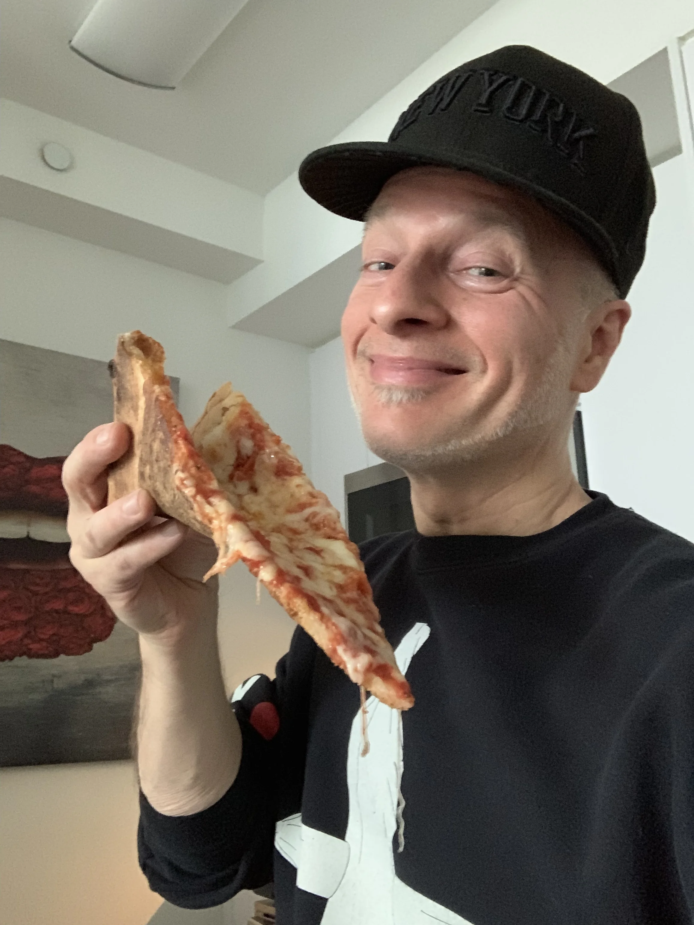 The slice from Pipitone’s with its cheap cheese.