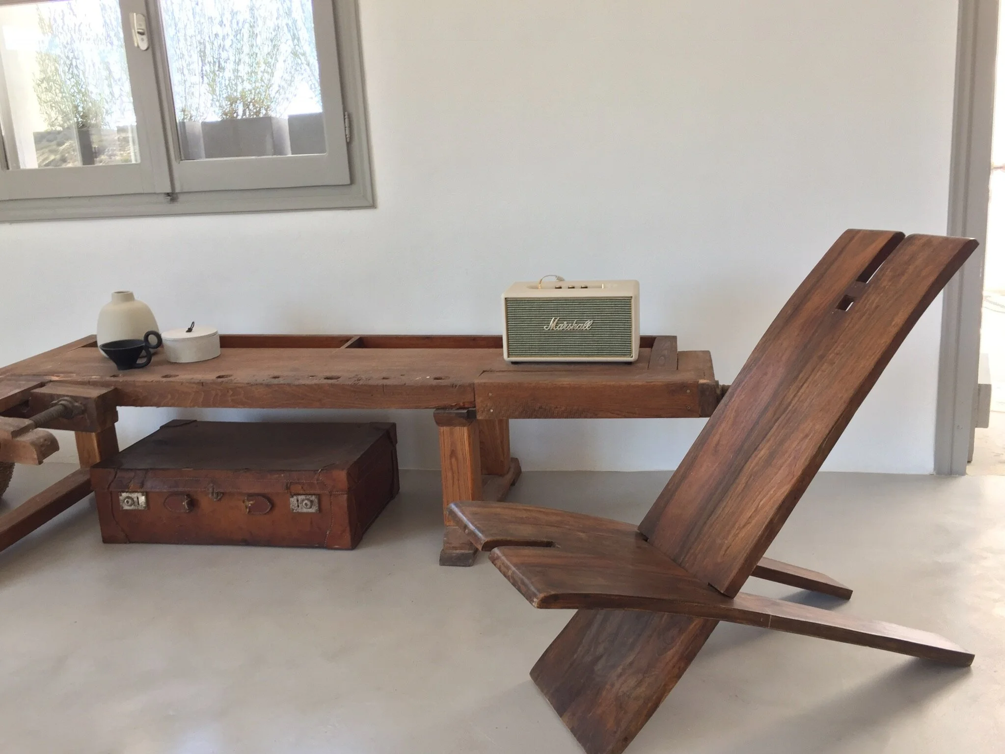 old carpenter’s bench and modern sound system harmoniously co-existing in Horizon House