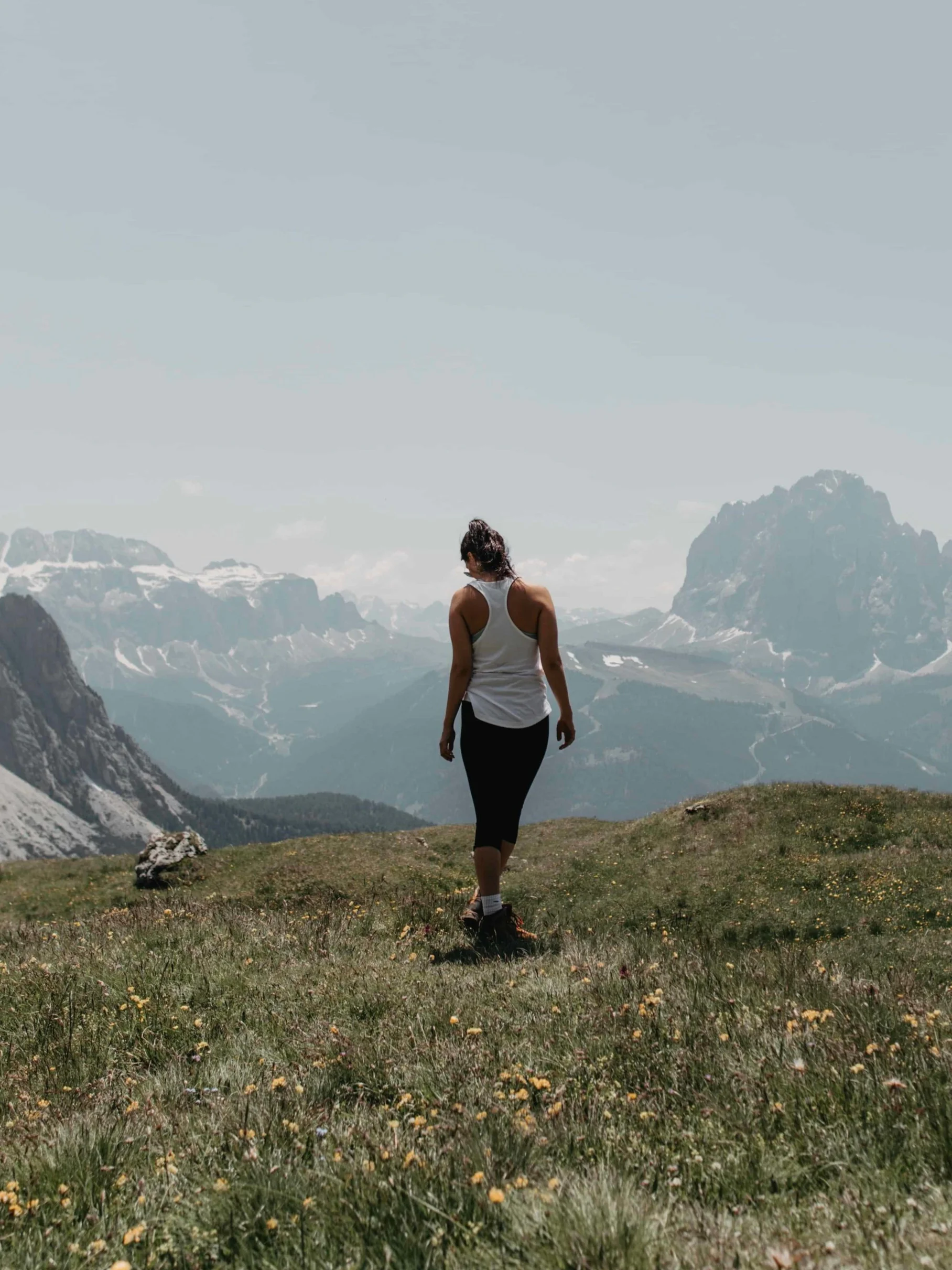 hiker standing over mountains
