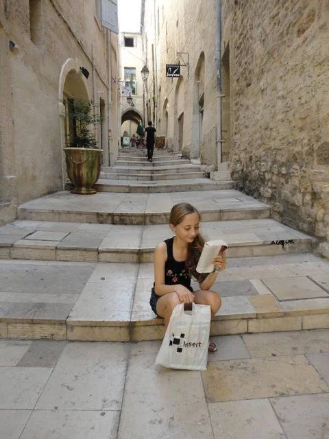 Zoe reading on steps
