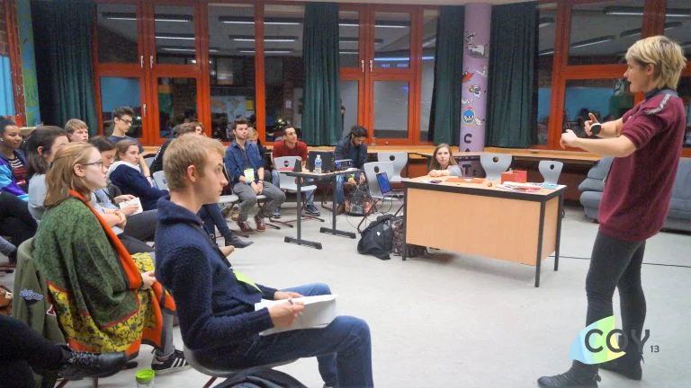 Emily teaches a Care About Climate session with Sarah Voska at COY13