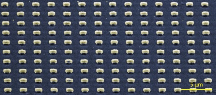 A scanning electron microscope image shows submicron-scale cavities patterned into films of aligned carbon nanotubes developed at Rice University. The cavities trap thermal photons and narrow their bandwidth, turning them into light that can then be recycled as electricity. Credit: Naik Lab/Rice University