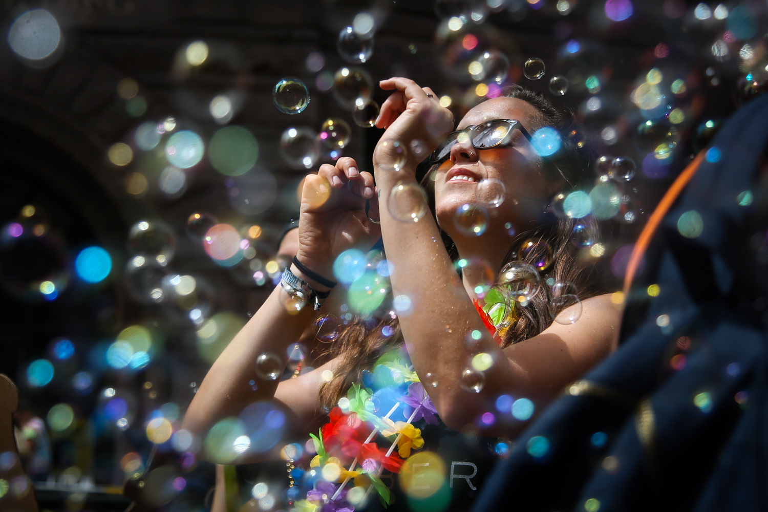  A woman dances in a cloud of bubbles in the annual Pride parade in San Francisco, California 