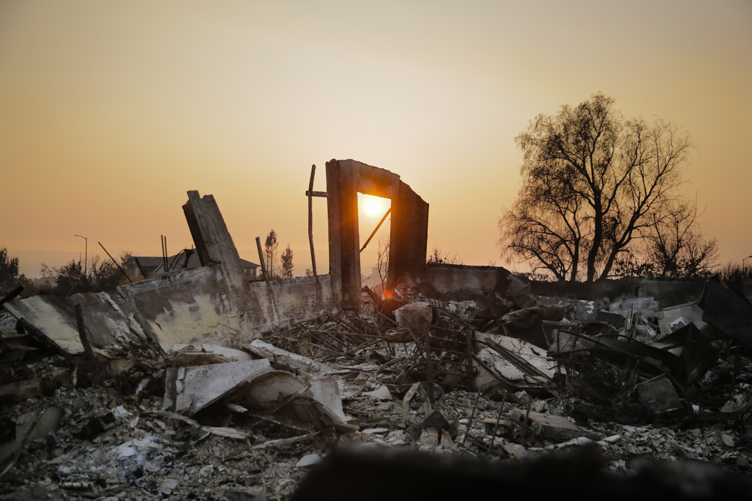  The sun is seen through an arch in the remains of a home in the Fountaingrove neighborhood in Santa Rosa, California 