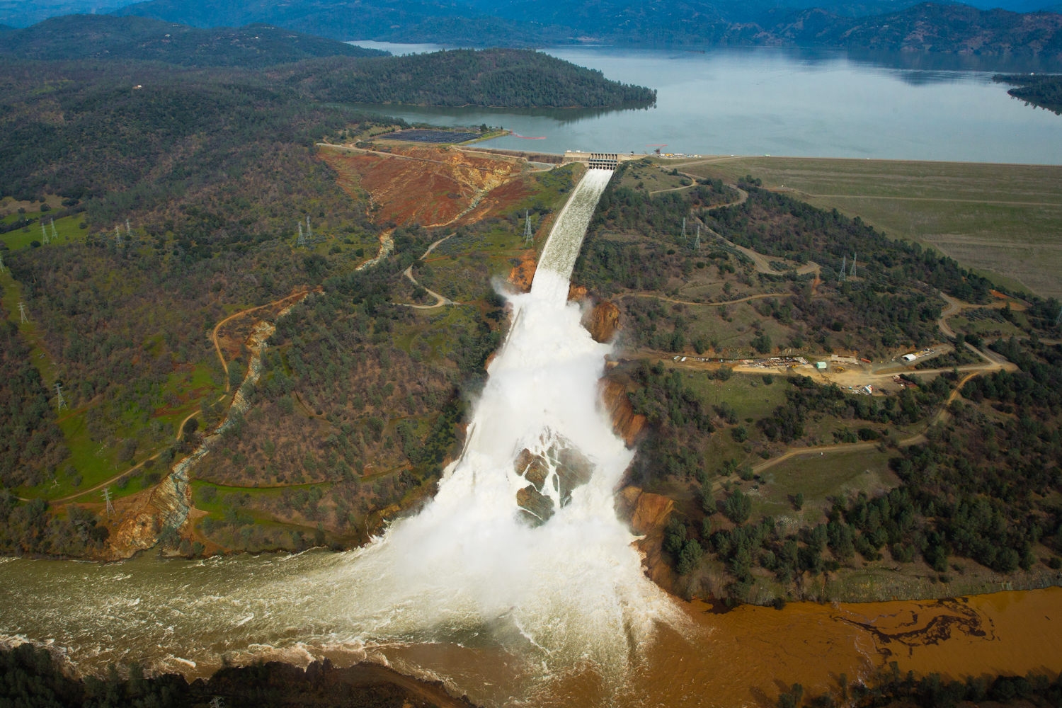  Oroville lake, the emergency spillway, and the damaged main spillway are seen from the air in Oroville, California 