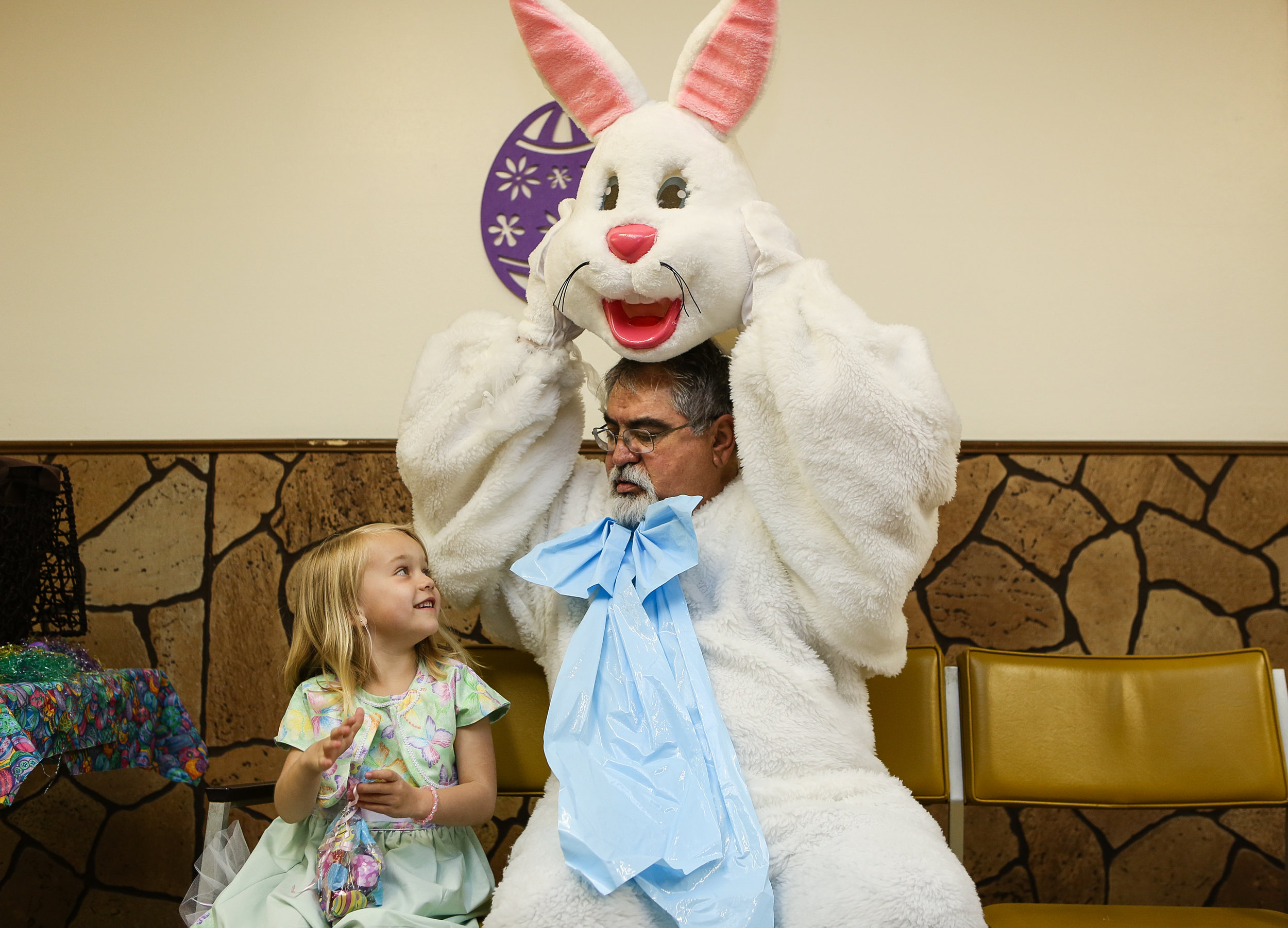  Katelyn Ragsdale shares a moment with Larry Lambert as the Easter Bunny in Ray, North Dakota 