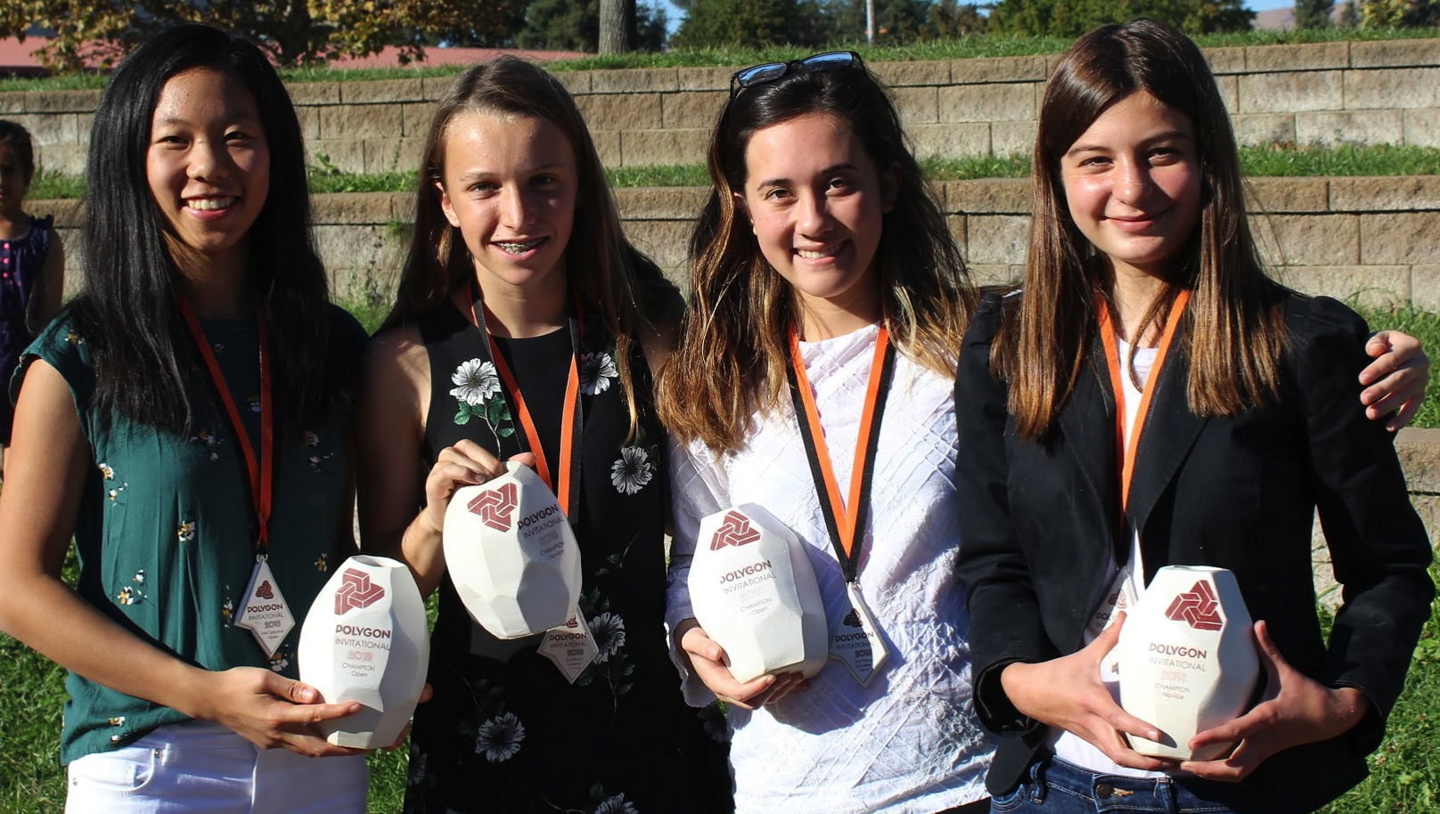 Yuan, Kenderski, Bonet, & Tolajian pose after awards ceremony with hand crafted polygon trophies