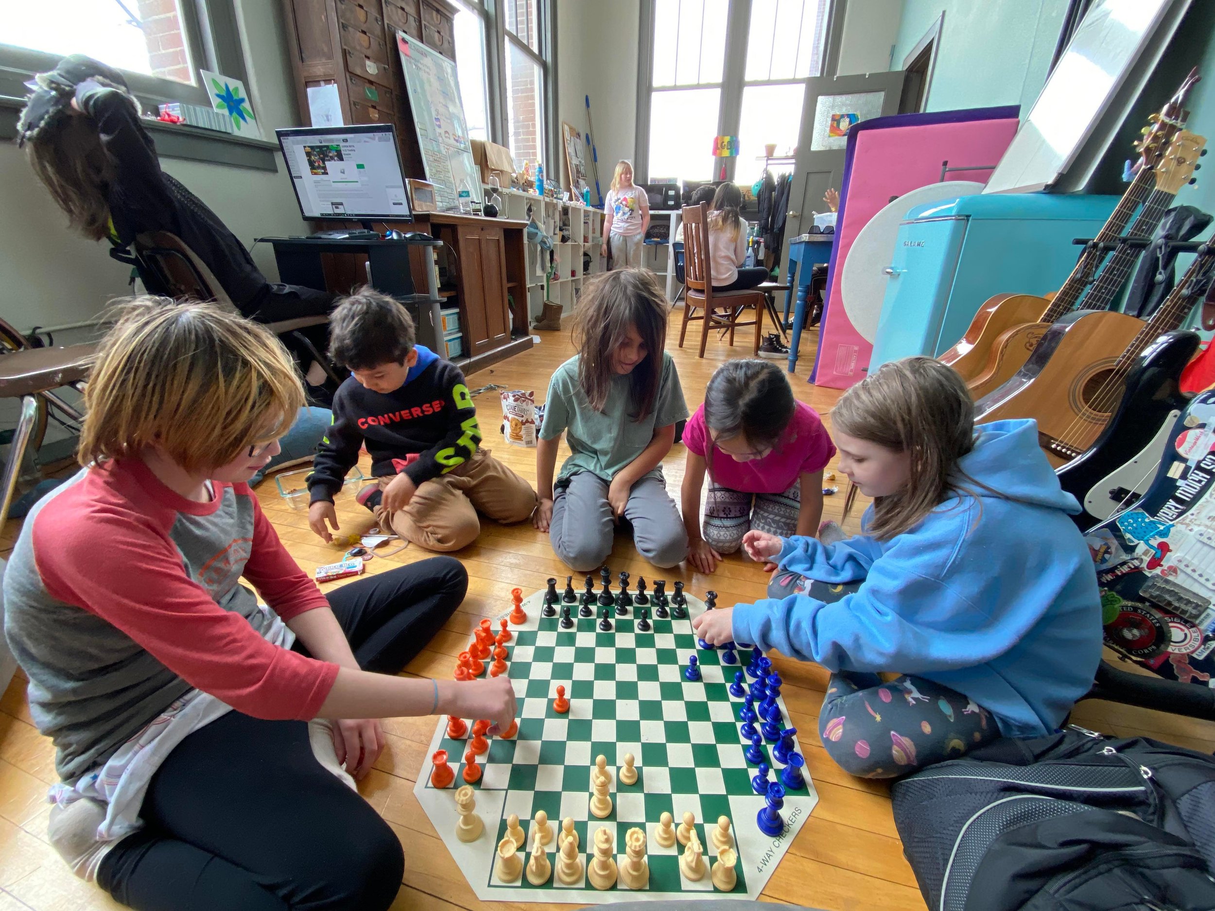 Premium Photo  Young white child playing a game of chess on large chess  board chess board on table in front of school boy thinking of next move