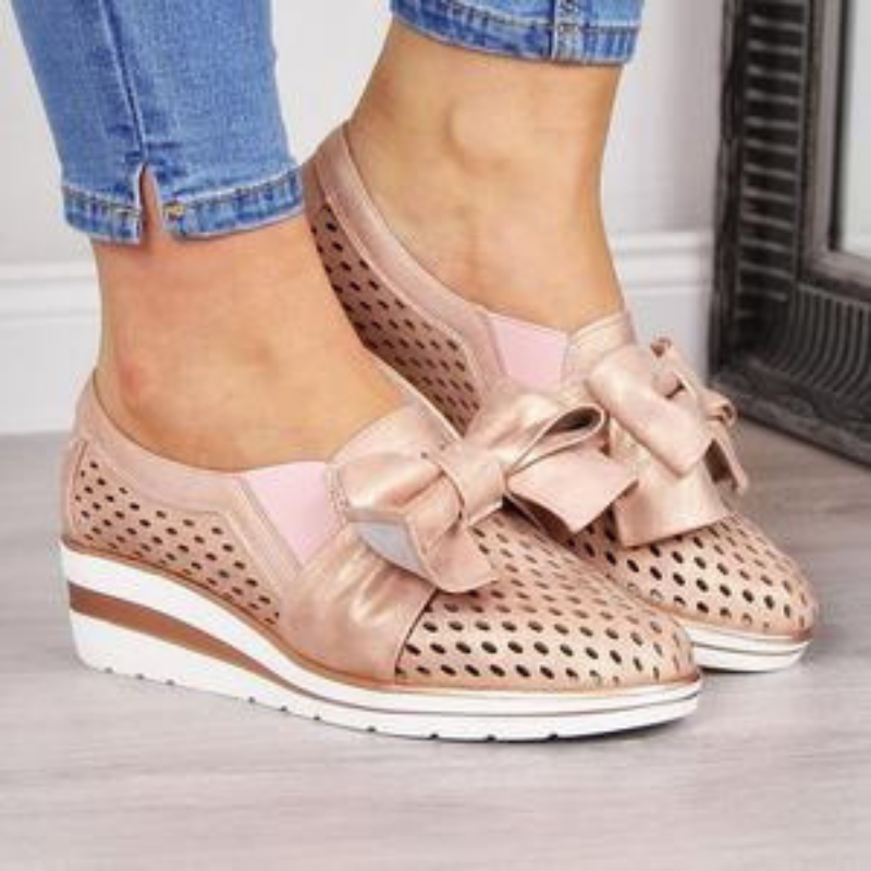 Soft pink with a wedge heel and a bow!