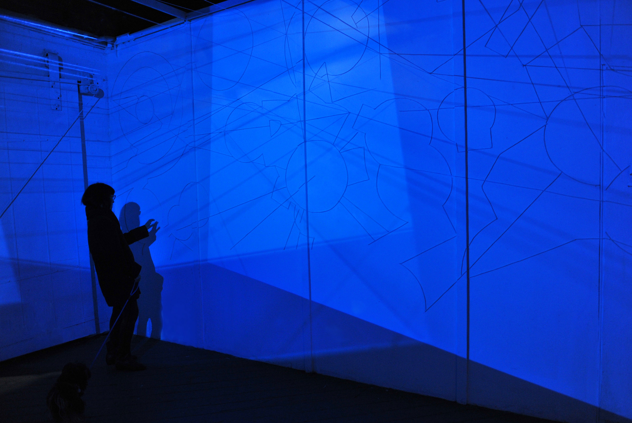 A Cielo Aperto #2 (2015), site specific 4 channels installation with plastic strings on walls, variable dimensions