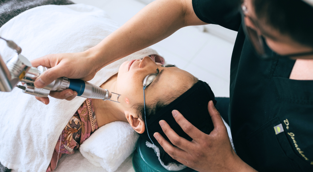 Doctor performing picosecond laser treatment for melasma at a Singapore clinic