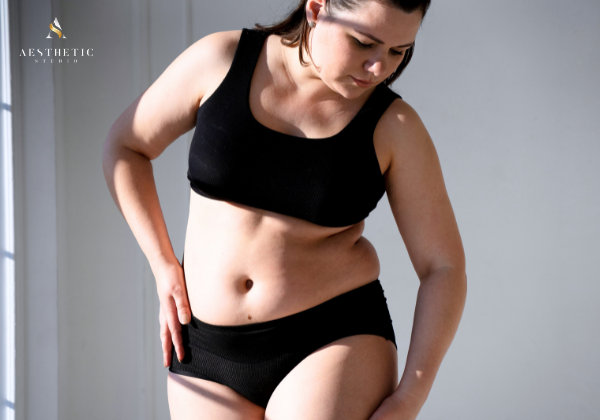 Woman evaluating body changes as part of a doctor-led weight loss programme in Singapore