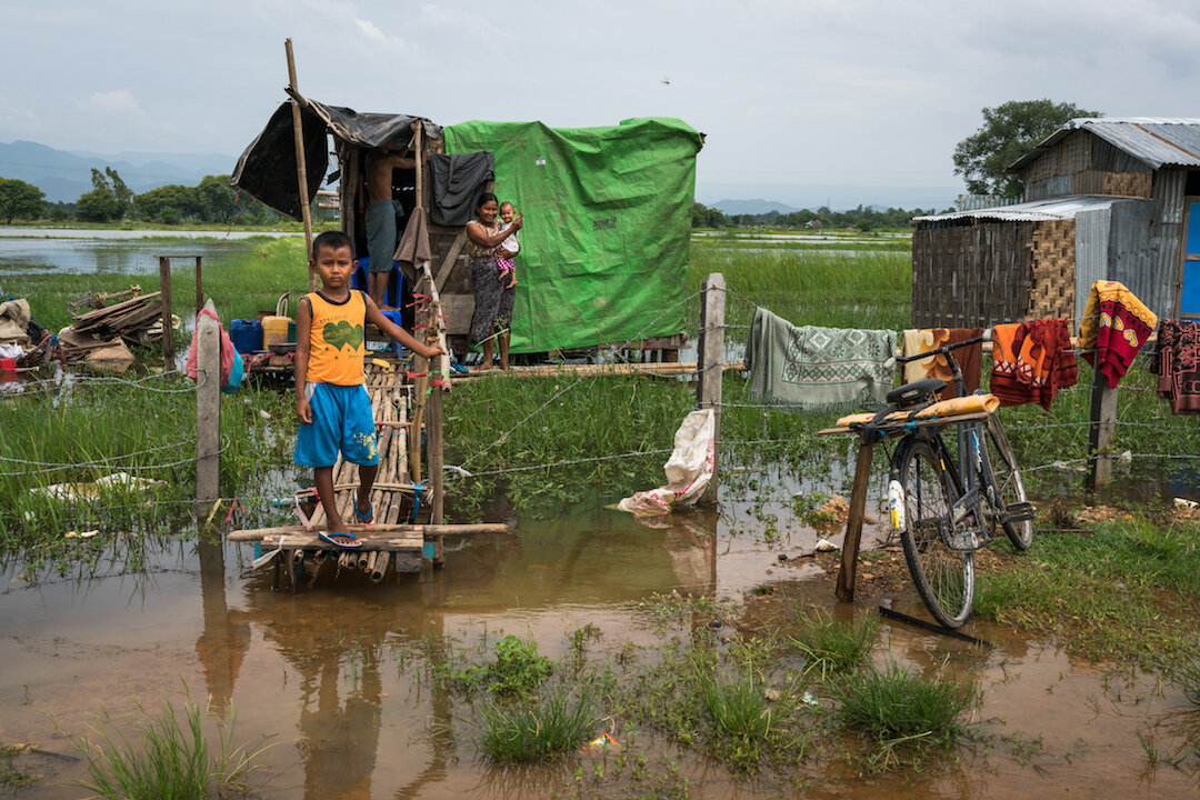 A family during the monsoon season, Mandalay