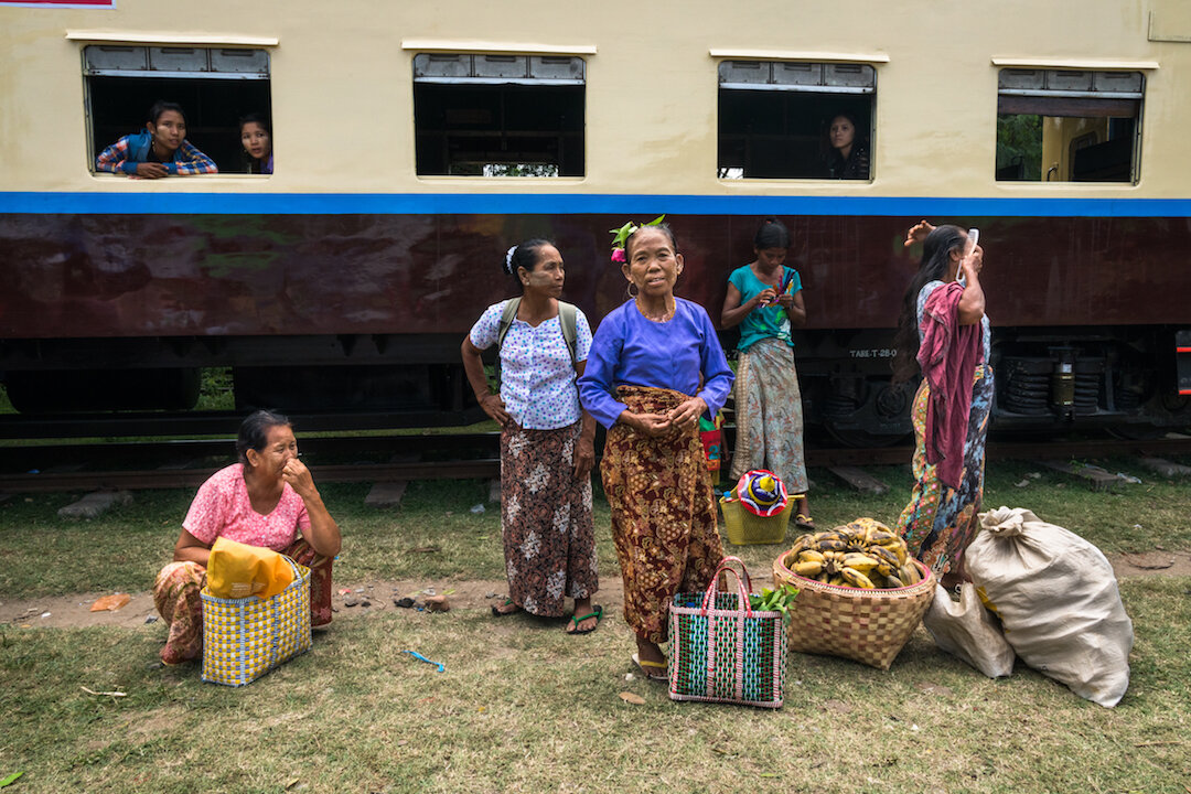 Women wait to board&nbsp;a train, Taung Byone&nbsp;Village