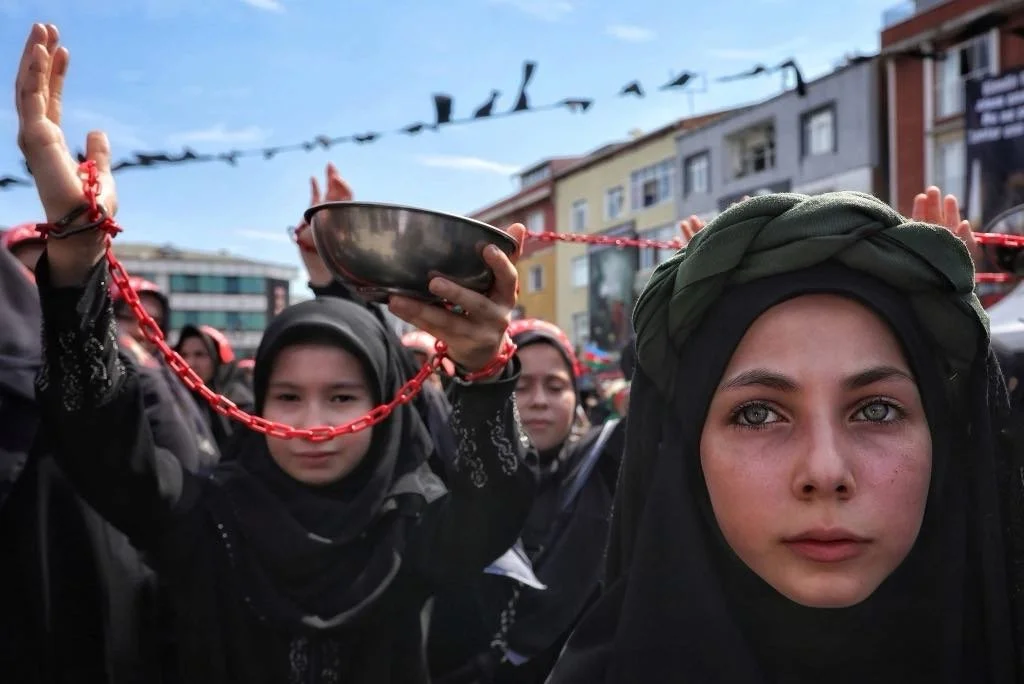 Metin Yener - The main theme of the demonstration is more evident in those to the left of the girl, despite the focus being on her. A powerful message lies behind this layered image.