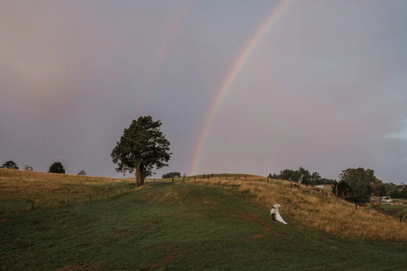 What a day for Kya &amp; Daniel 

Sunshine, sudden downpours, and gale-force winds that turned umbrellas inside out every 20 minutes&hellip; and not once did it dampen the spirit.

Married on their family farm, surrounded by love, and a whole lot of 