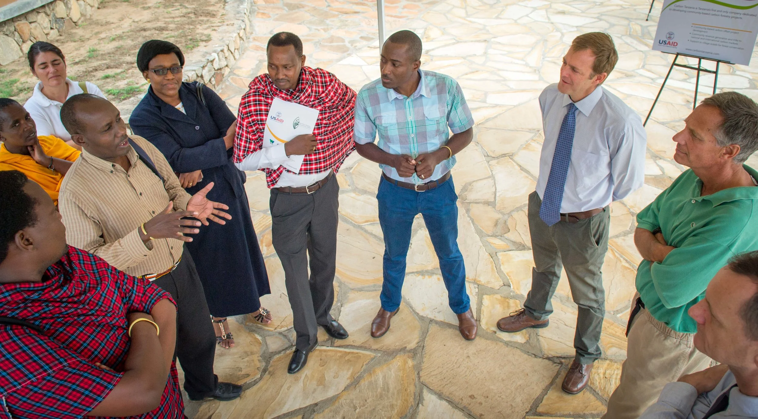 Makko Sinandai, Executive Director of UCRT, speaks to US Ambassador to Tanzania, Mark Childress, at the launch of the new USAID-funded project, "Endangered Ecosystems of Northern Tanzania." Photo Copyright NTRI/EENT/Roshni Lodhia