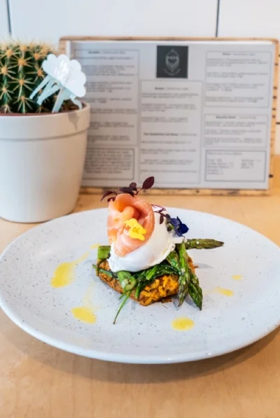 Sweet potato and spinach rosti, smoked salmon, poached egg, asparagus and chilli oil
