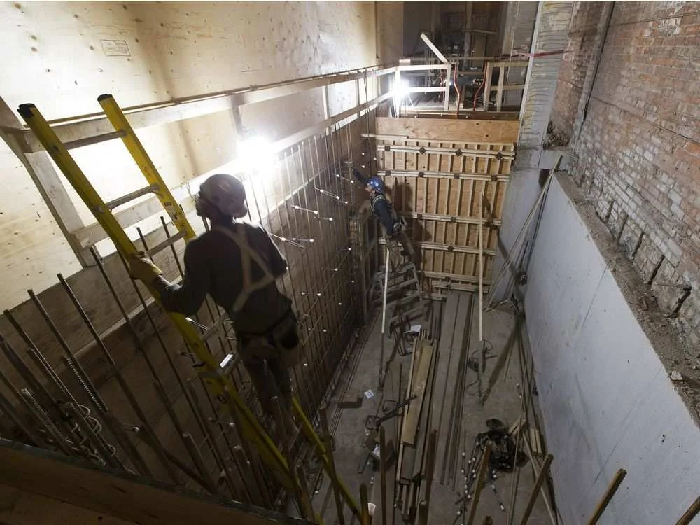 Workers put in rebar in the stair core of the Brighton Block on Friday, June 15, 2018. GREG SOUTHAM GREG SOUTHAM / GREG SOUTHAM