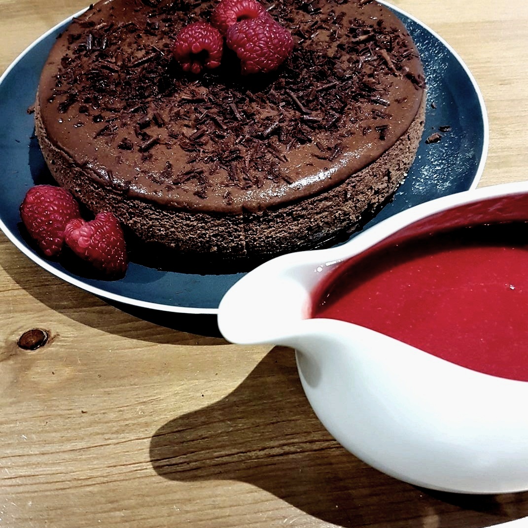 Triple chocolate cheesecake with raspberry coulis. Mmm.