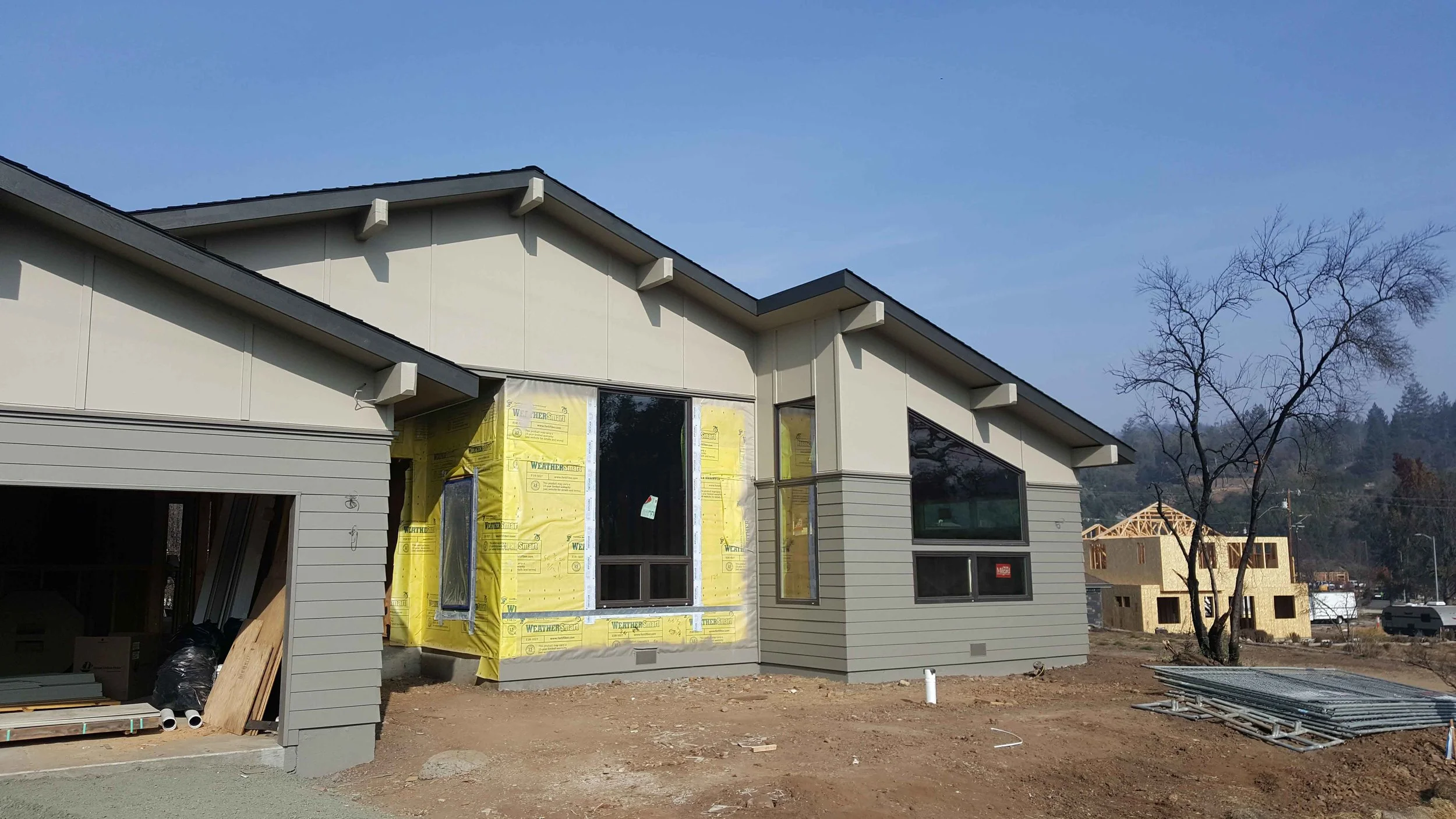 Exterior siding now awaiting the stone veneer.