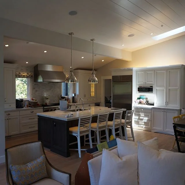 I love the mix of black and white cabinets in this kitchen and how a beam was used to open the space.

#kitchendesign #whitecabinets #black cabinets #modern  #modernkitchen  #stainlesssteel  #tile  #whitecountertops