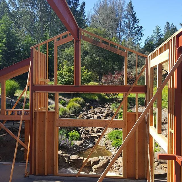 The progress continues on this fire rebuild. The interior view of the waterfall under the house is taking shape and will be a big part of the final design as intended. Here's a look from the mezzanine. #redmaplearchitects #kenbermanart #waterfall #mezzanine