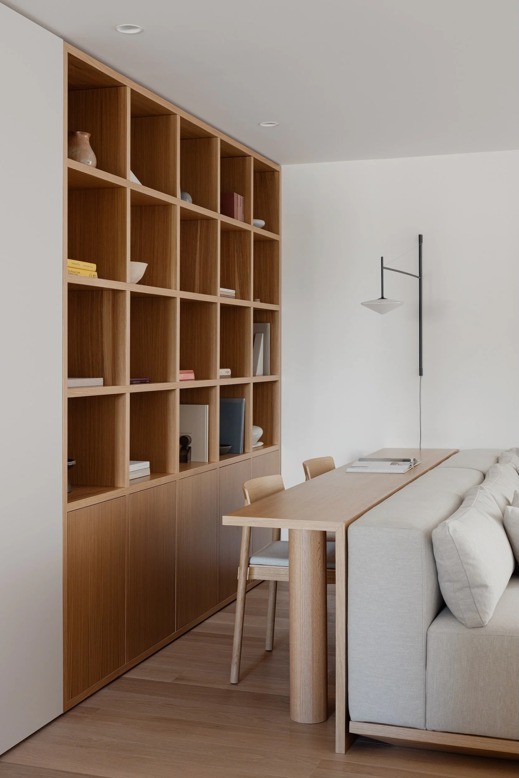 Lola Cwikowski Studio Cascais Residence project with custom oak shelving & console desk; &Tradition Betty TK2 chairs; Somma Carpintaria sofa with Maria Menino pillows in Lauritzon Aqua; Vibia Tempo sconce; Fenesteves oak floor.