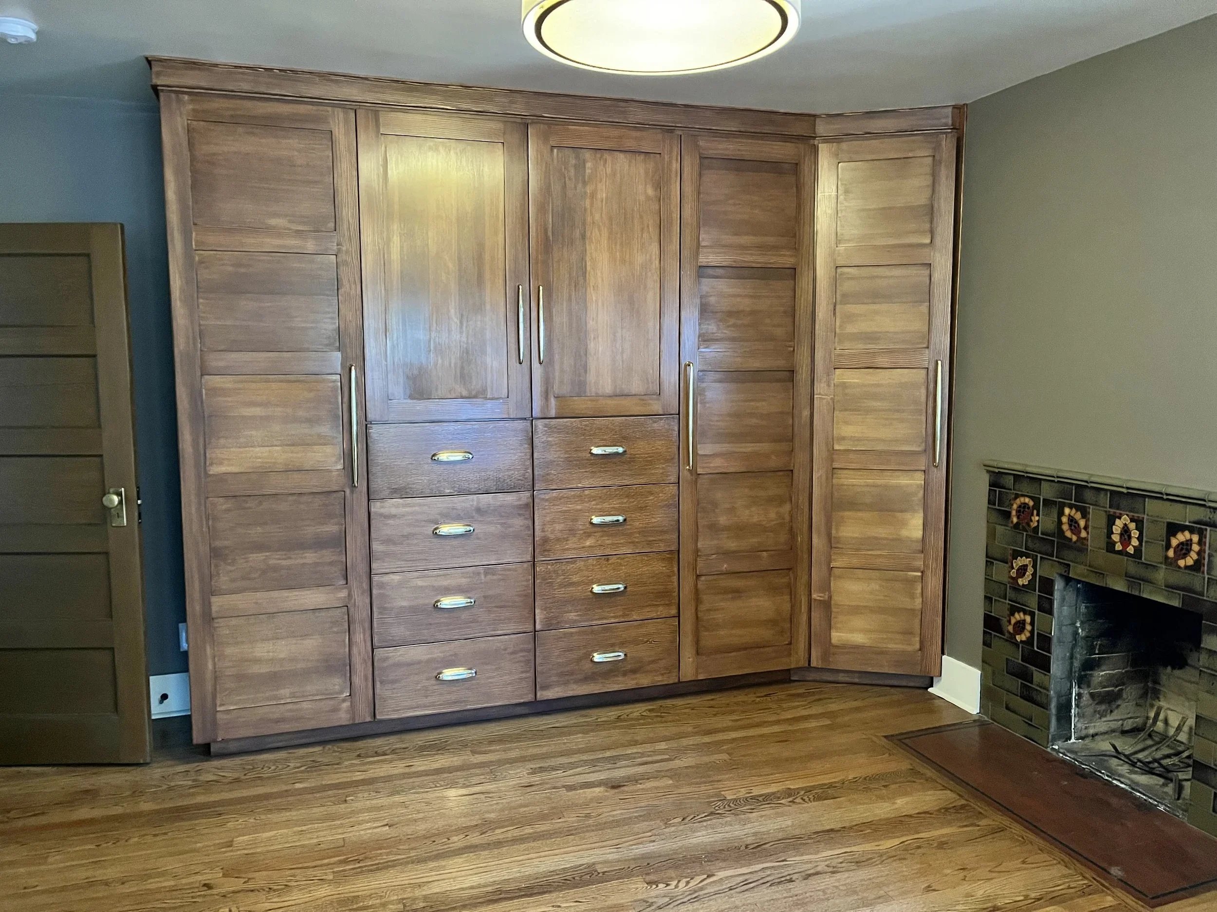 Custom master bedroom built-in closet with drawers and cabinetry in historic Northeast Portland home
