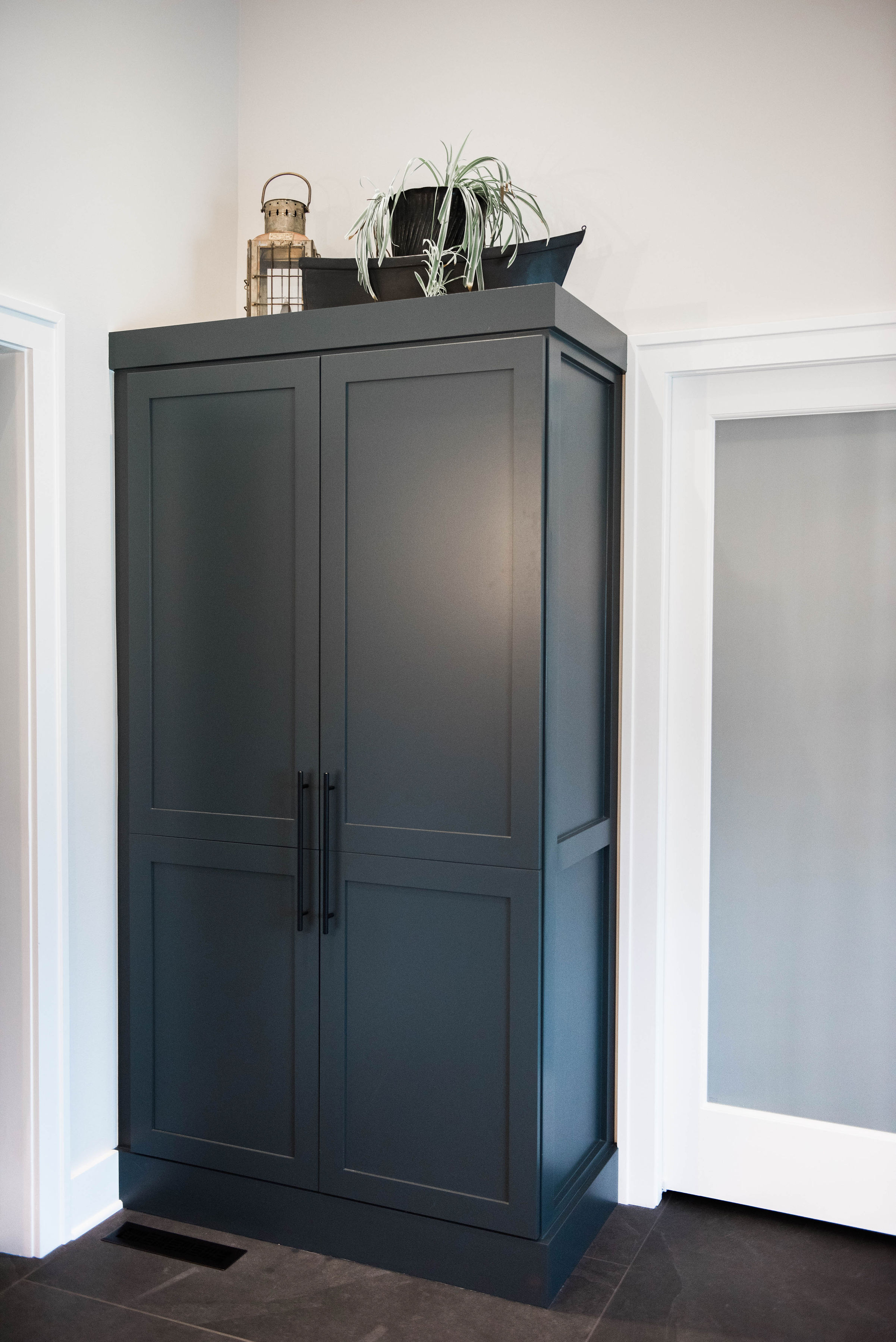 There used to be a built in linen closet recessed into the wall that looked really dated. Joel built a custom piece thats large enough to fit everything.