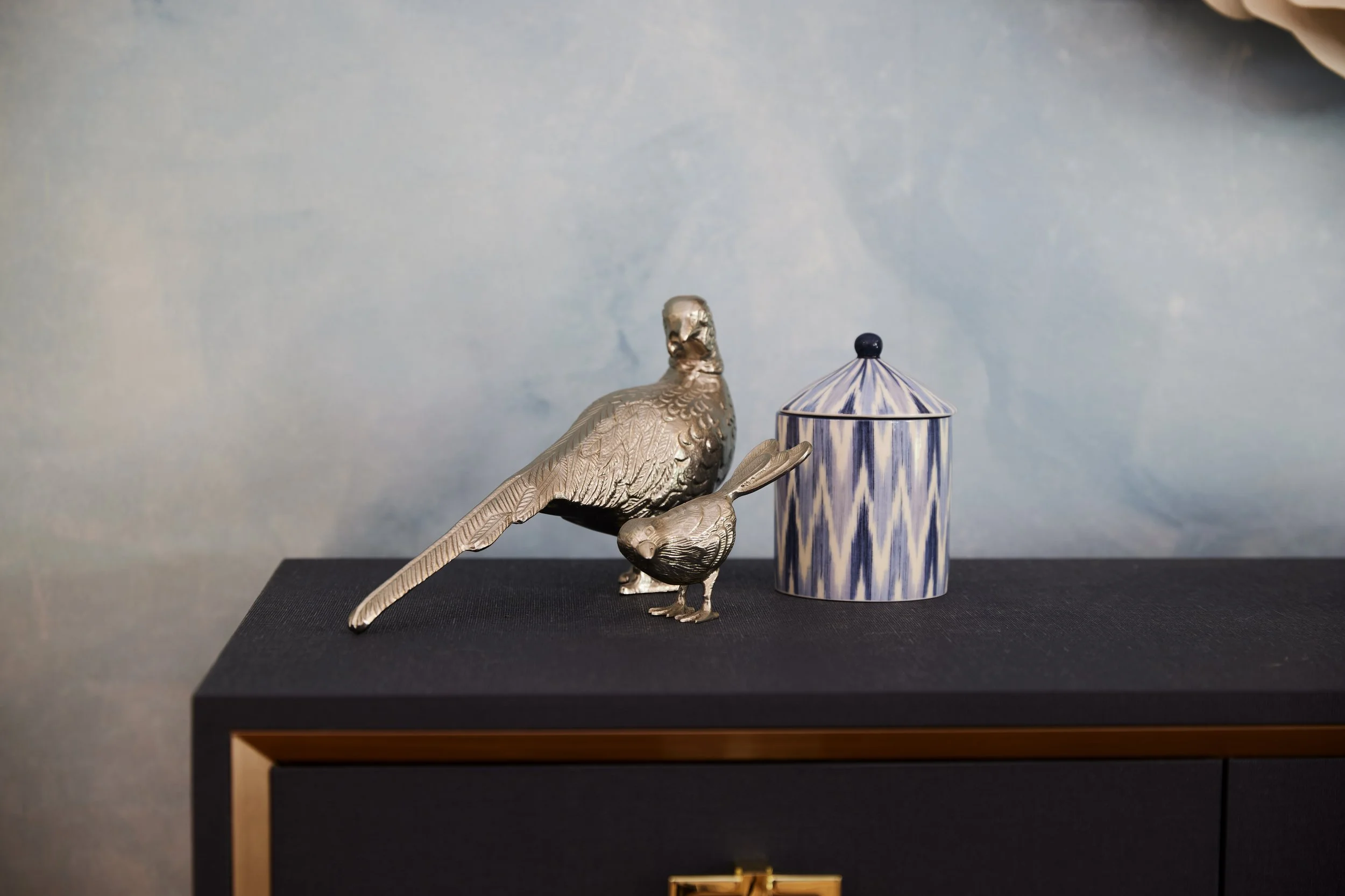  We mixed traditional and contemporary pieces in this home to achieve the transitional look. Bringing in newer pieces with cleaner lines helped to bring new life to this traditional aesthetic. 