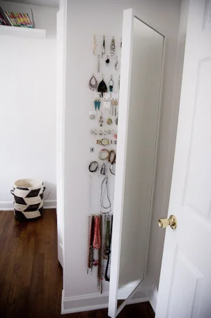 This one is a whole endeavor, but if you’re up for a bigger project, this one will save you so much space while still keeping everything organized and not just stashed in a jewelry box. Learn how here .
