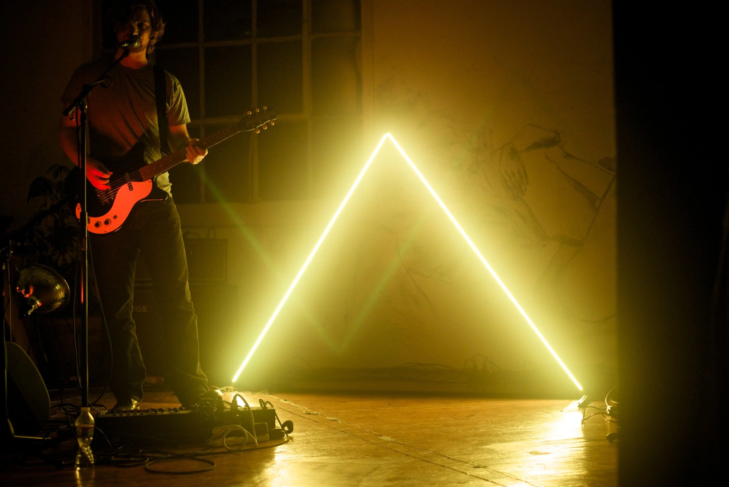 Electronic Countermeasures, created a series of LED deltoids driven by animated video, to back the unique microtonal pop sound of the 11ins . The design consisted of two aluminum triangles covered with individually addressable RGB LEDs and a large floor based LED triangle. Electronic Countermeasures used animation to quickly build intricate animated lighting effects that matched the complexities of the 11ins microtonal compositions. These animations were then fed into Electronic Countermeasures new openFrameworks LED mapper, that converts video or Syphon feeds into ArtNet to control each LED pixel on the strips of the triangular forms. 