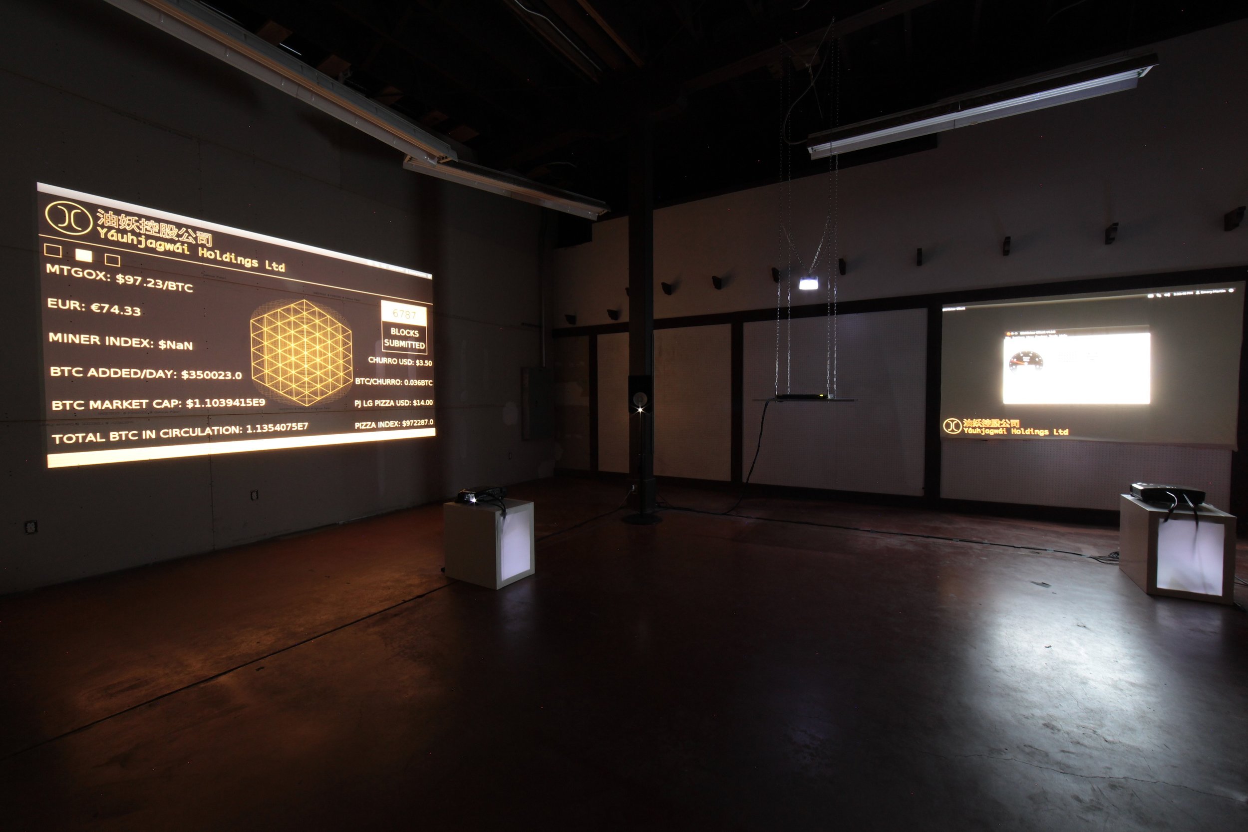 The show included two channels of projection running off a single 1U Ubuntu server aka Miner One suspended from the ceiling in the center of the gallery. Miner One, runs a Processing sketch that parses current Bitcoin exchange rate data from ounce.me that is then displayed as one of the projection channels in addition to scrolling news ticker. The second channel shows the interface of the Bitminter Bitcoin mining software.