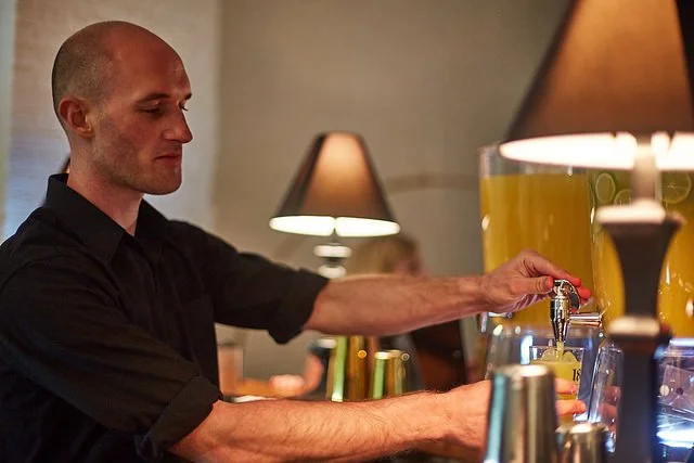 Bartender pouring specialty cocktail for 1800 Tequila brand activation event in nyc.