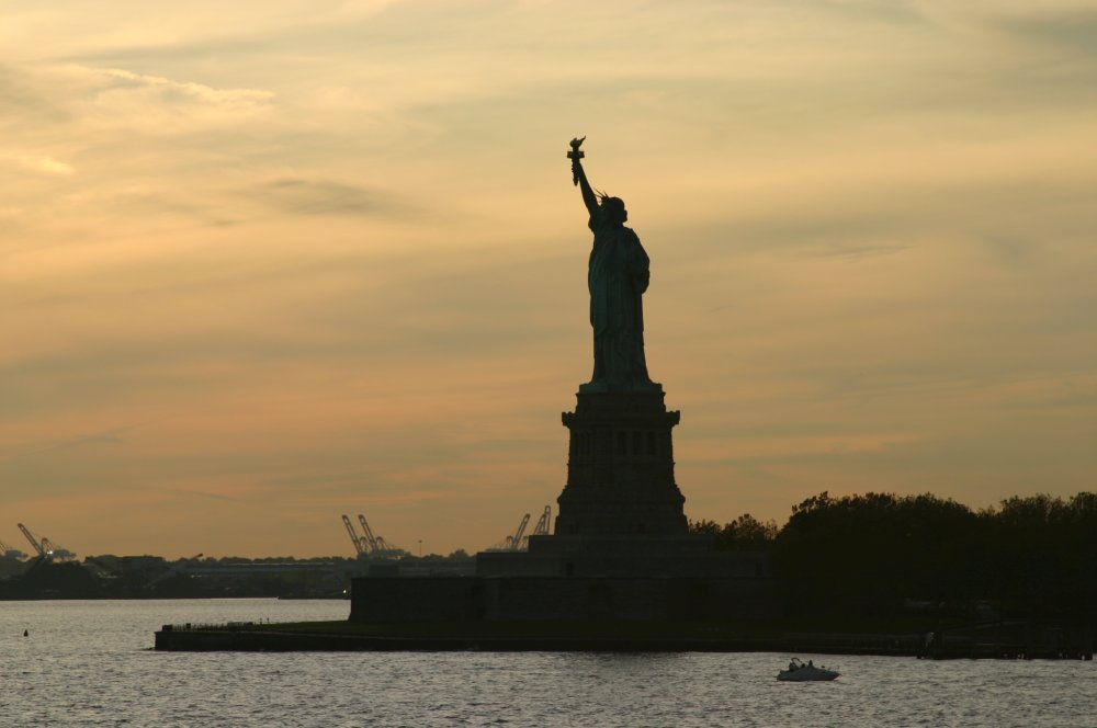 Lady Liberty at dusk, as seen from the Staten Island Ferry. “Everything at Ellis Island reminded me of our family, except that we came on planes, not boats.” -Meena, Same Sun Here