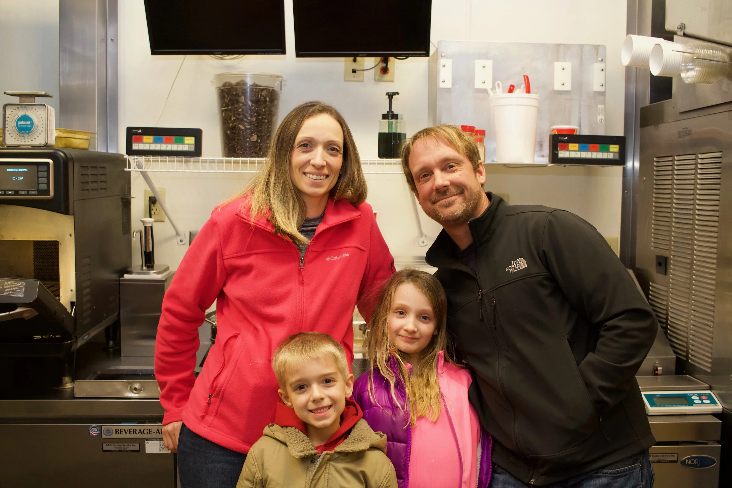 Pam and John with their son Zach and daughter Jami, Christmas Eve making ice-cream.