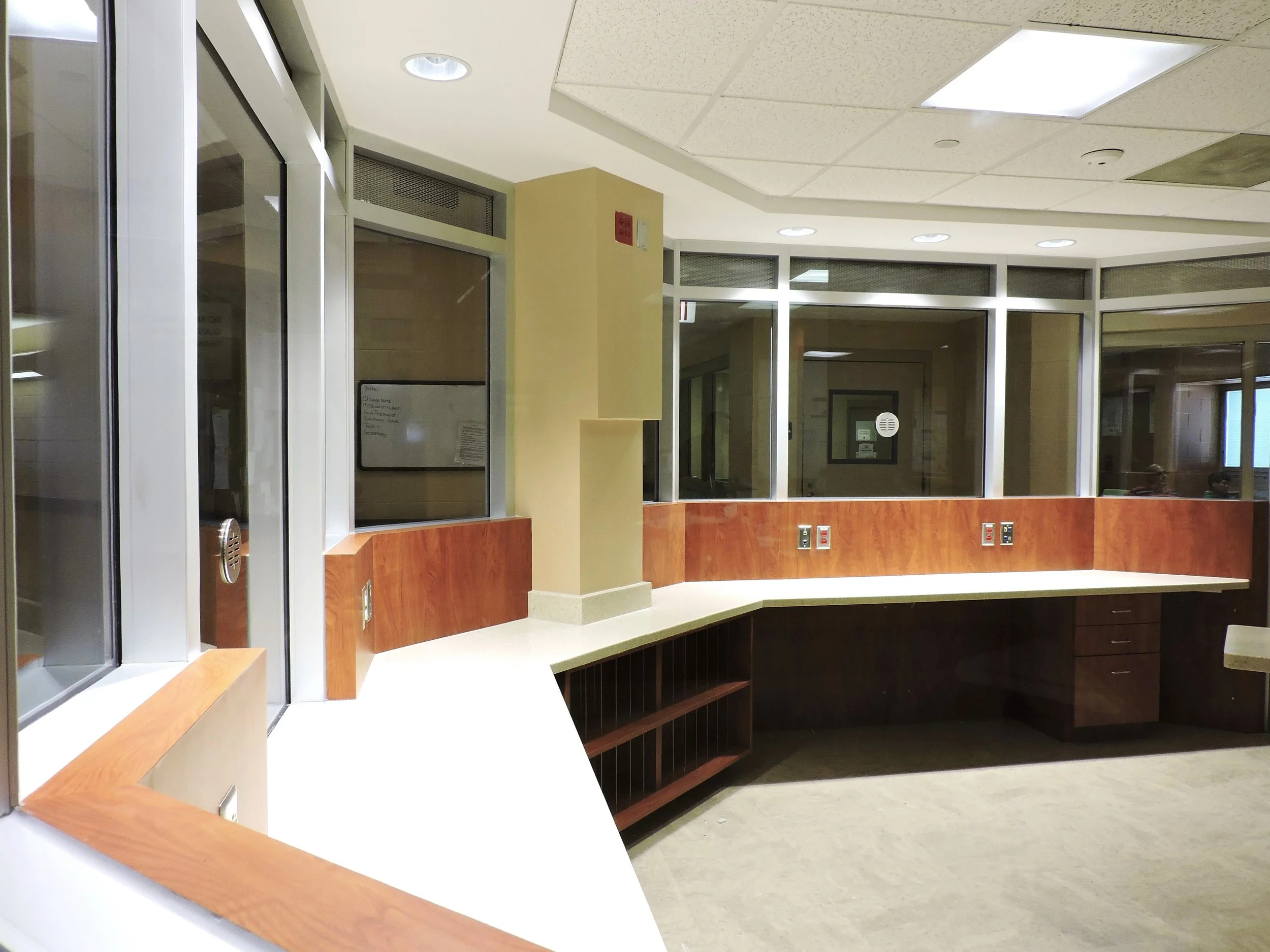 Storefront system. Recessed pass thru cabinet with interlocking mechanism.