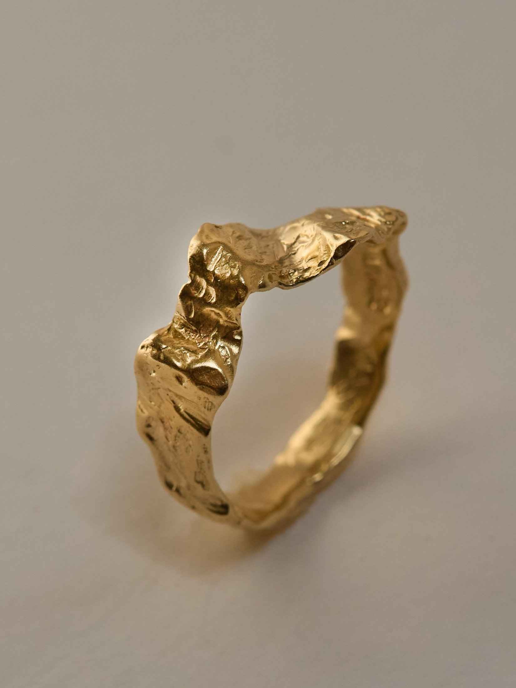 Wavy textured band in 10k yellow gold on the occasion of receiving a Masters in Writing.