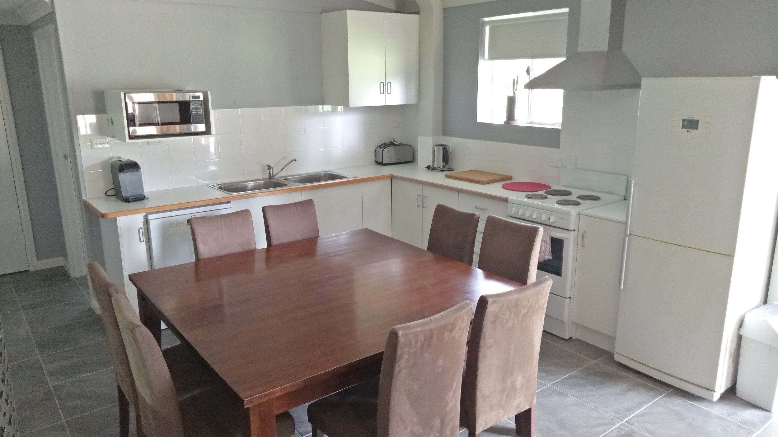 Fully Equipped Kitchen and 8 Seat Dining Table