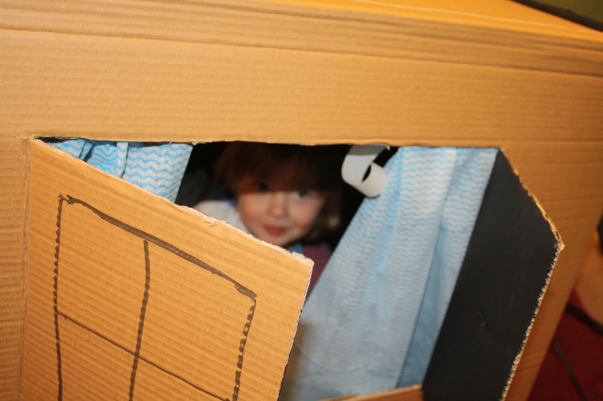 Little Caleb playing peekaboo on set