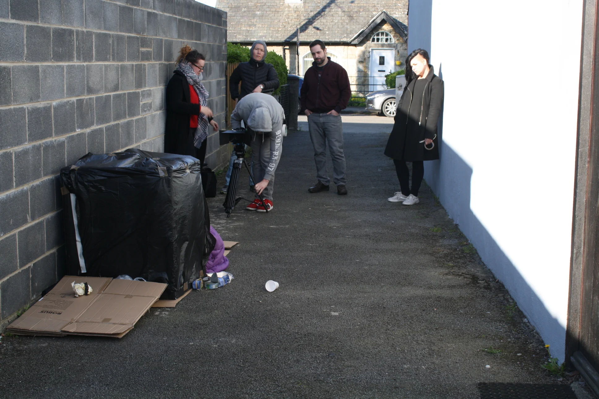 Prepping the alleyway for th depressing homeless scenes