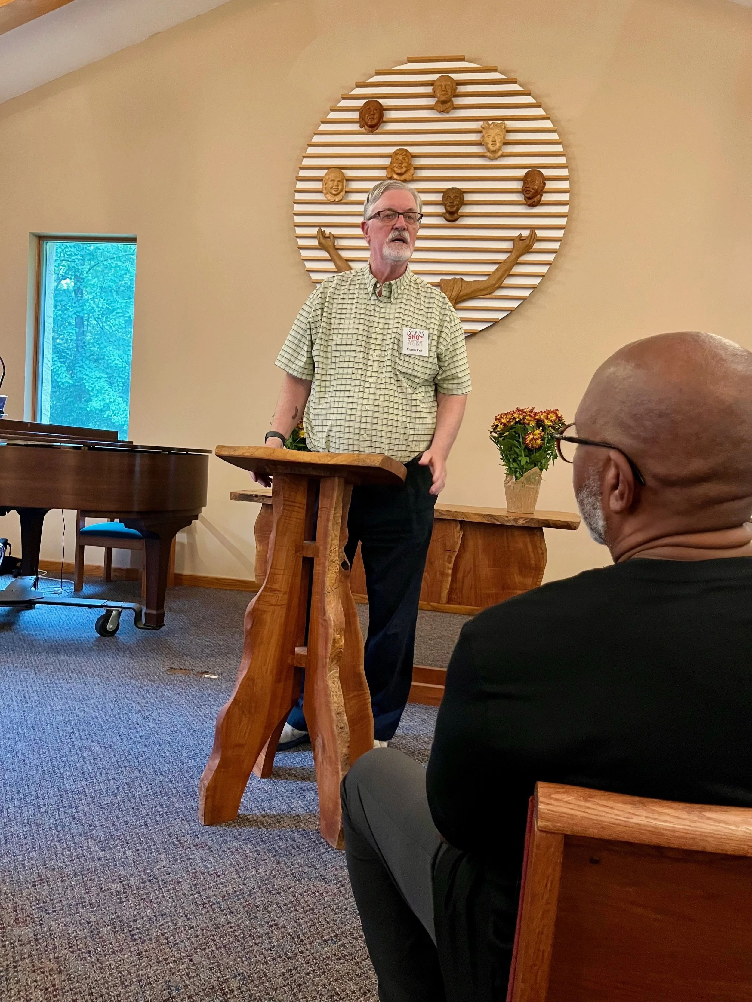 Volunteer Charlie Karl honoring founder Laura Madeleine