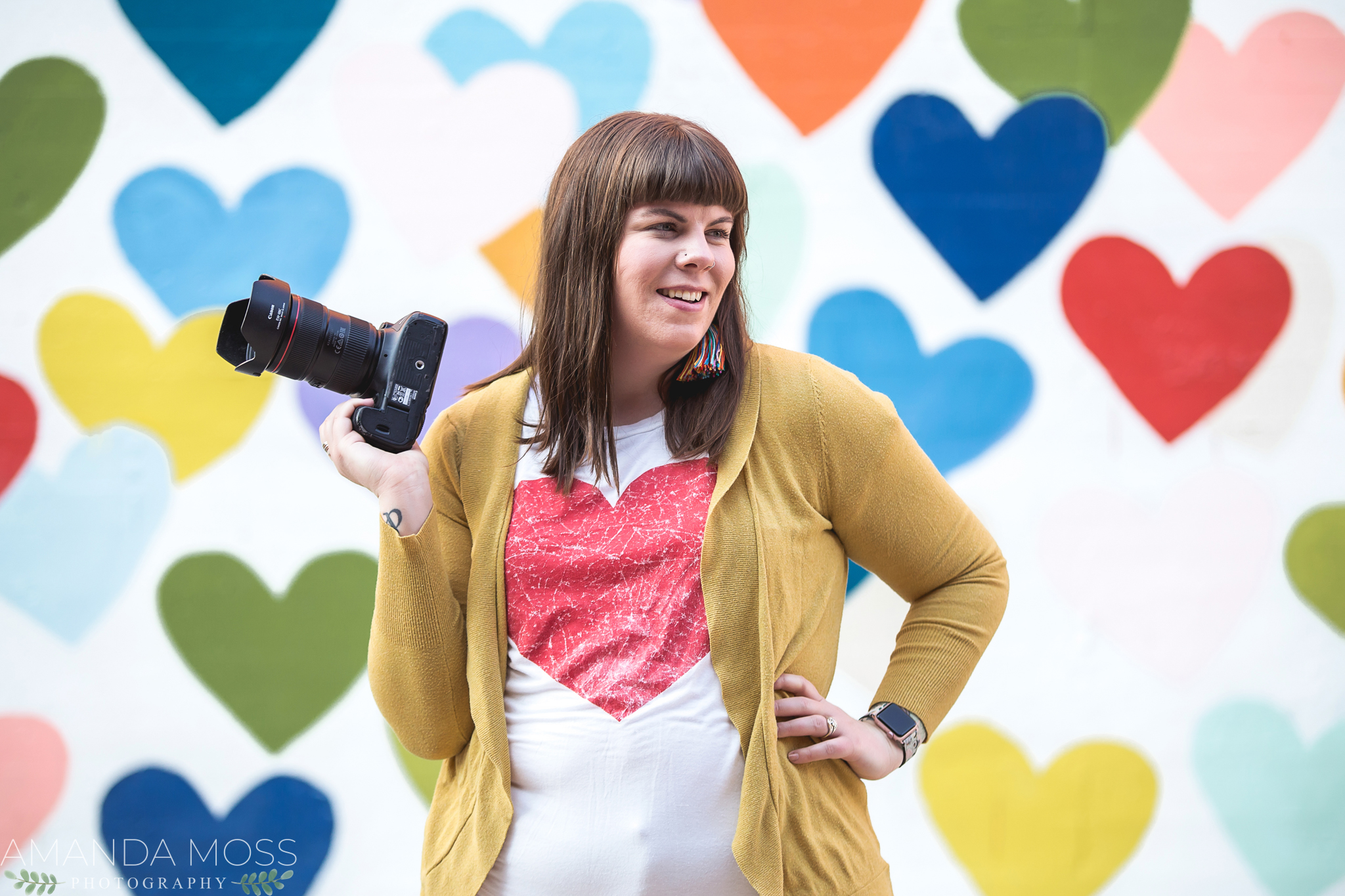 charlotte north carolina headshot branding portrait photographer south end noda fun silly confetti hearts wall