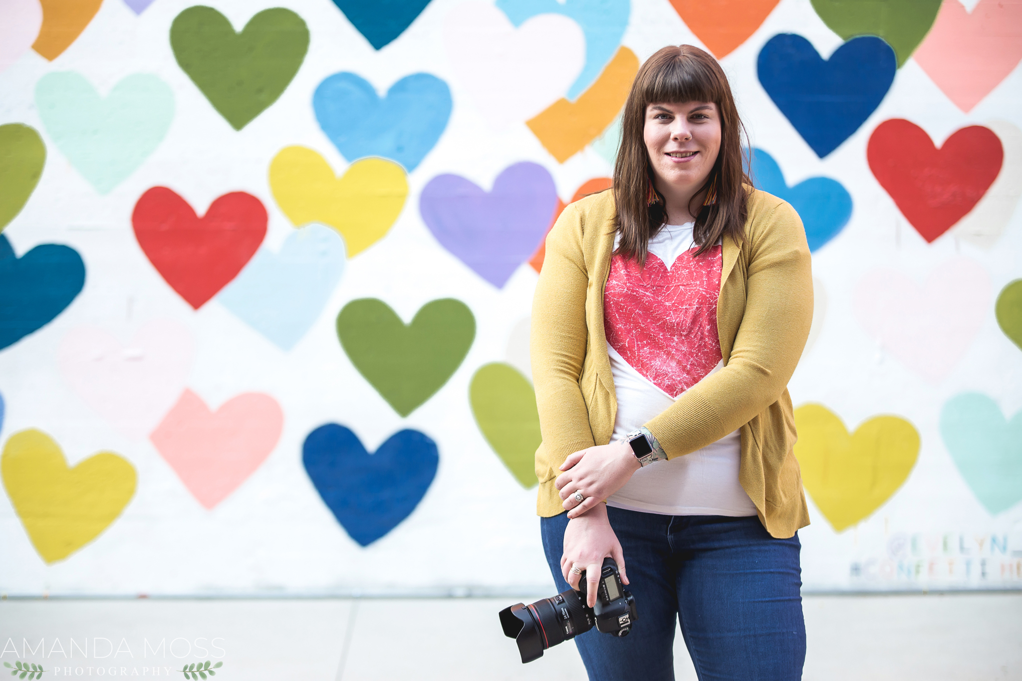 charlotte north carolina headshot branding portrait photographer south end noda fun silly confetti hearts wall