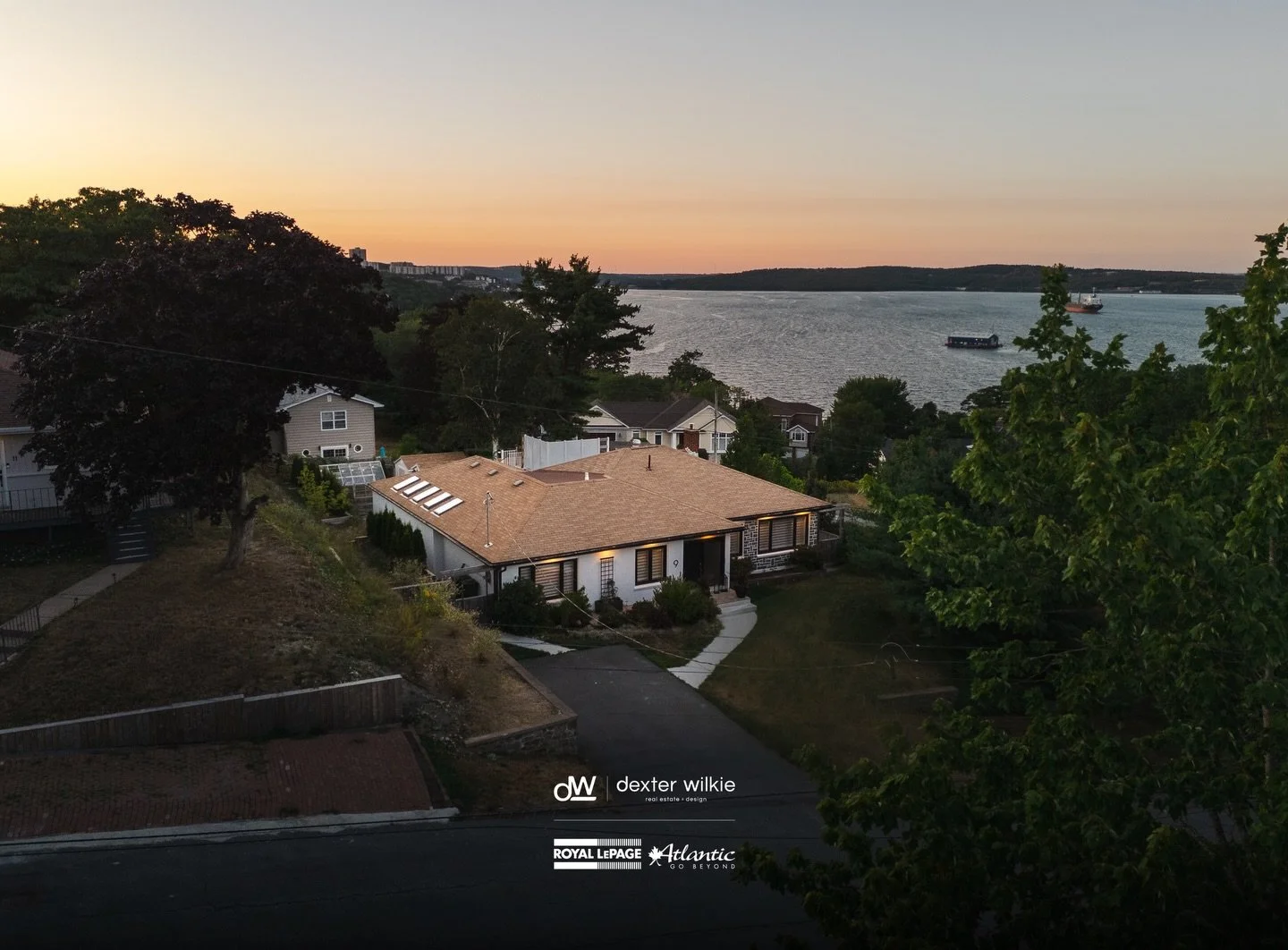 Set against sweeping Bedford Basin views, this 3-bedroom, 3-bath home feels like a private escape from the pace of everyday life. Every detail has been intentionally designed, from the hidden mudroom and dramatic glass-walled office to the warm, refi