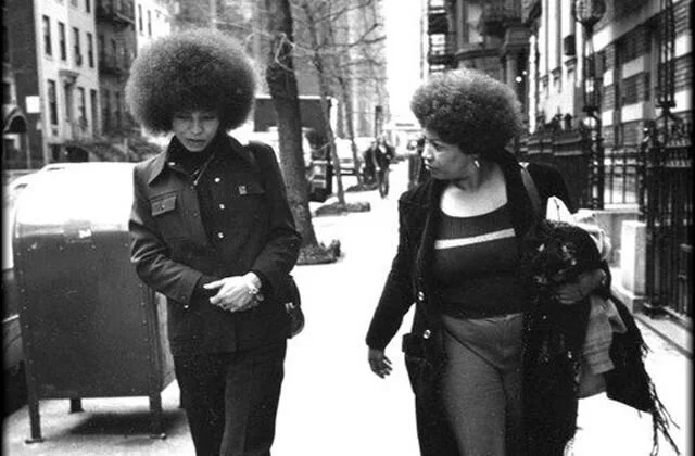 Morrison walking with Angela Davis on March 28, 1974. Jill Krementz