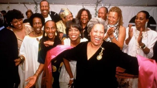 Nobel laureate Toni Morrison (center) accepting the applause of partygoers Susan Taylor, Rita Dove, Oprah Winfrey, Angela Davis, Maya Angelou & others in 1994. Will Mcintyre/The LIFE Images Collection via Getty Images
