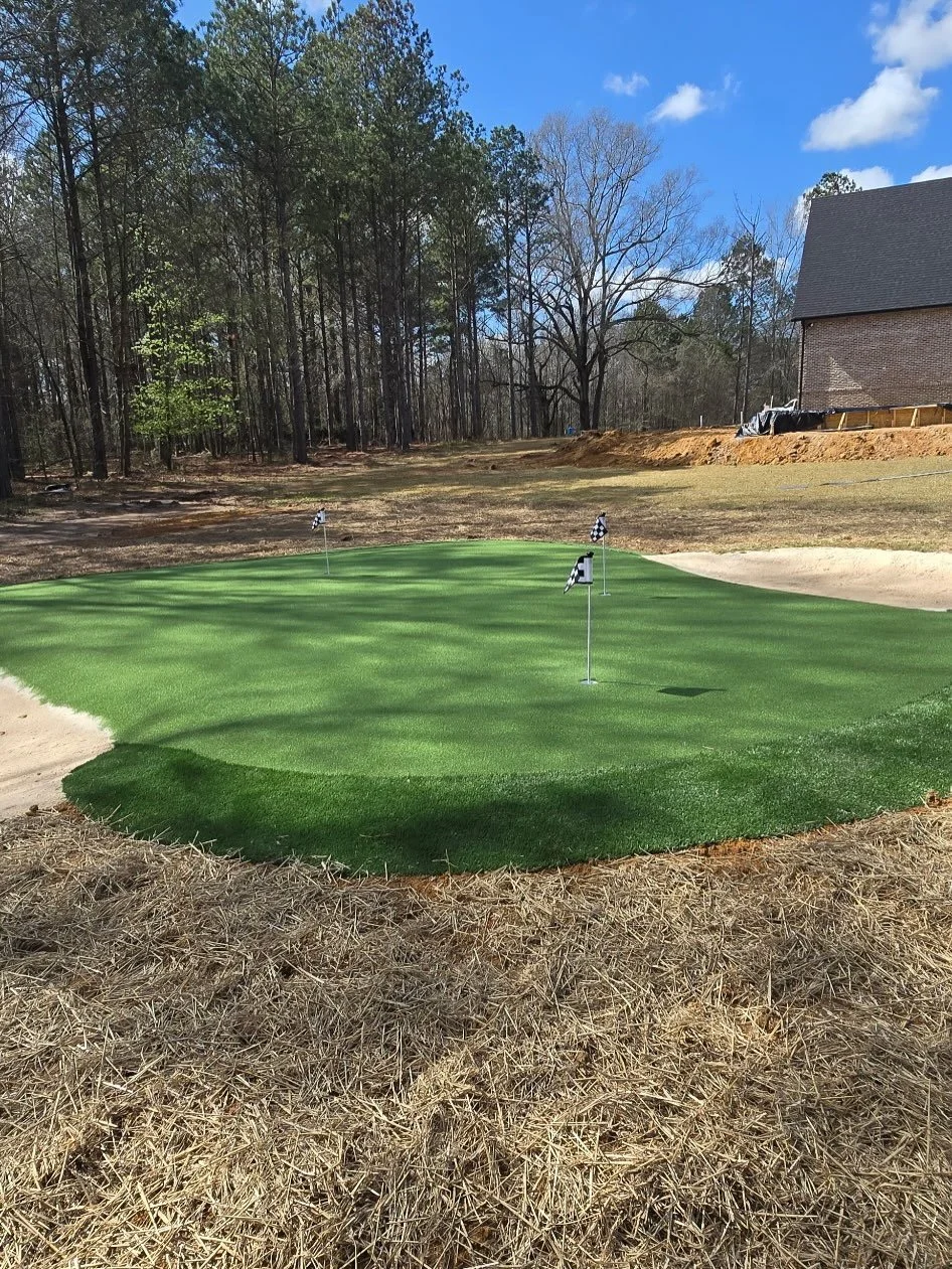 Fun putting, chipping green install! Complete with sand traps, 3 holes and some fun breaks on the green.

Next up is the pool which is elevated above the green.  Gonna be some fun memories made here. 

@haley.browning 
@elizabethb.09 
@ardjoshua 
@ca
